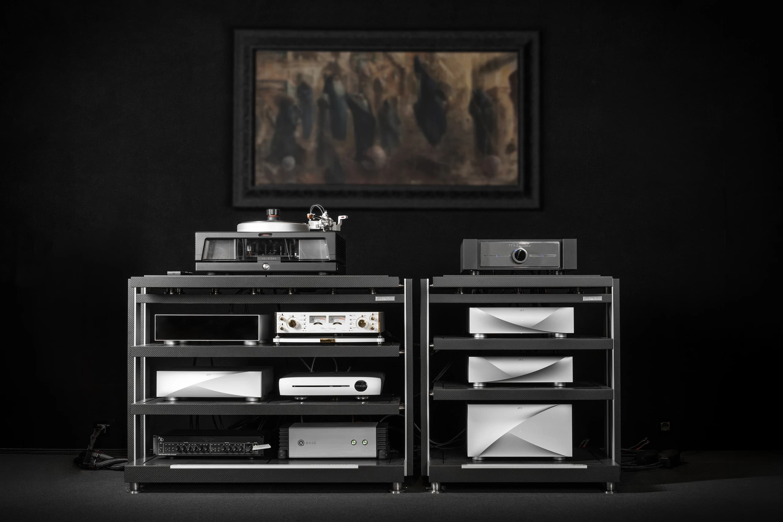 Two equipment racks with a turntable and the UBIQUITOUS 300B on top, below a framed painting